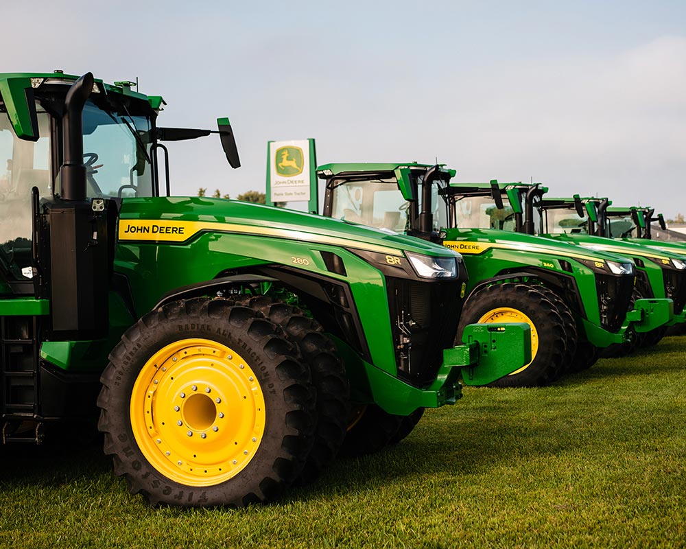 line of new John Deere 8R tractors for sale at Prairie State Tractor Lacon IL